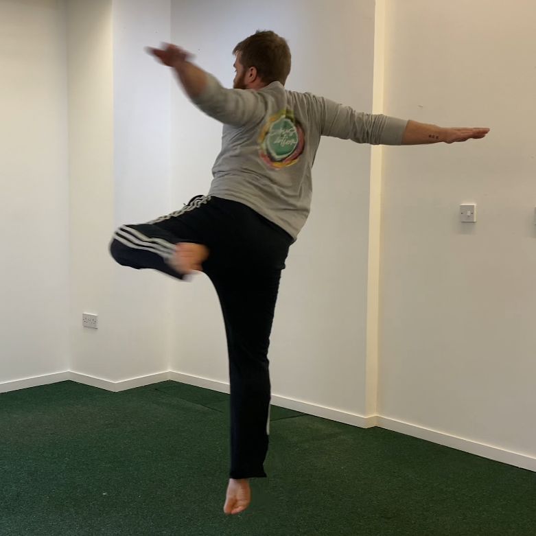 Male dancer twirling around in a ballet pose